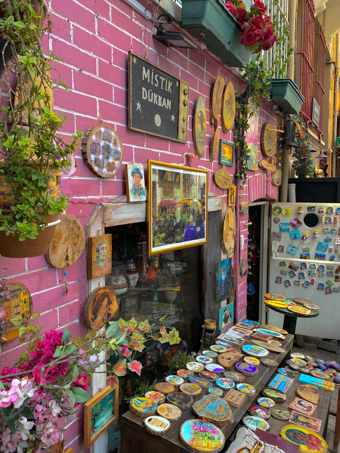 Vibrant outdoor display of handmade crafts and decor at a souvenir shop.